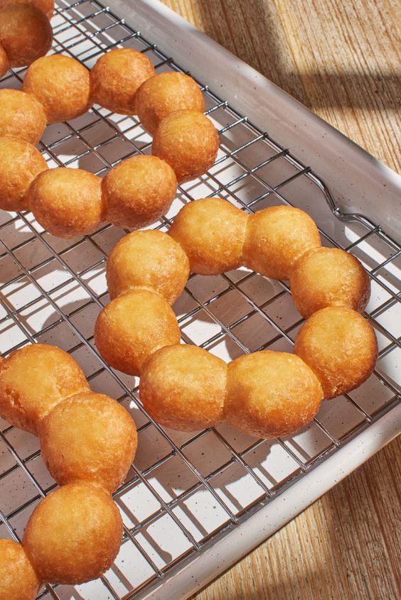 Classic Mochi Ring Donut - A light and chewy mochi ring donut, fried to a golden crisp. Its signature bubble-ring shape delivers the perfect balance of crunch and softness in every bite.